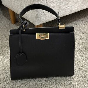 Chic Black Satchel with Gold Accents